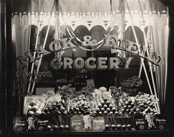 (ADVERTISING & STORE WINDOWS--FRUIT) A collection of 27 advertising and display photographs related to the Florida orange and citrus in